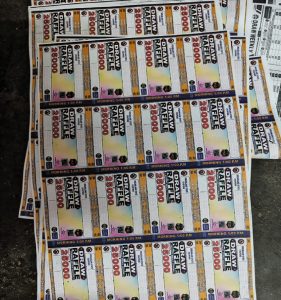 धनबाद में अवैध लॉटरी का बड़ा खुलासा: BCCL आवास में चल रहा था मिनी प्रिंटिंग प्रेस, 1 करोड़ की लॉटरी जब्त